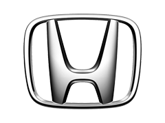 Close-up of a Honda logo emblem on a vehicle.