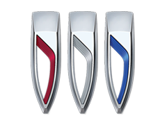 Three hair clippers with different colored grips: red, gray, and blue.