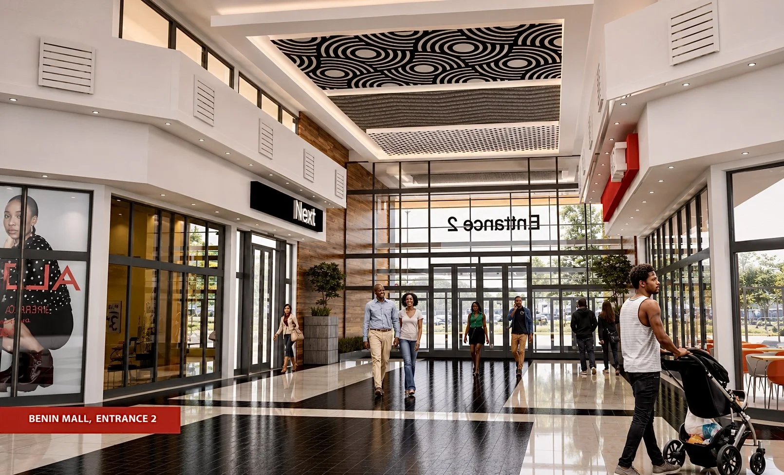 People walking inside a modern shopping mall with glass doors leading outside. The shopping mall has a high ceiling with patterned designs and large windows allowing natural light. There is a sign for 'Entrance 2' and people are seen with shopping carts and casual clothing.