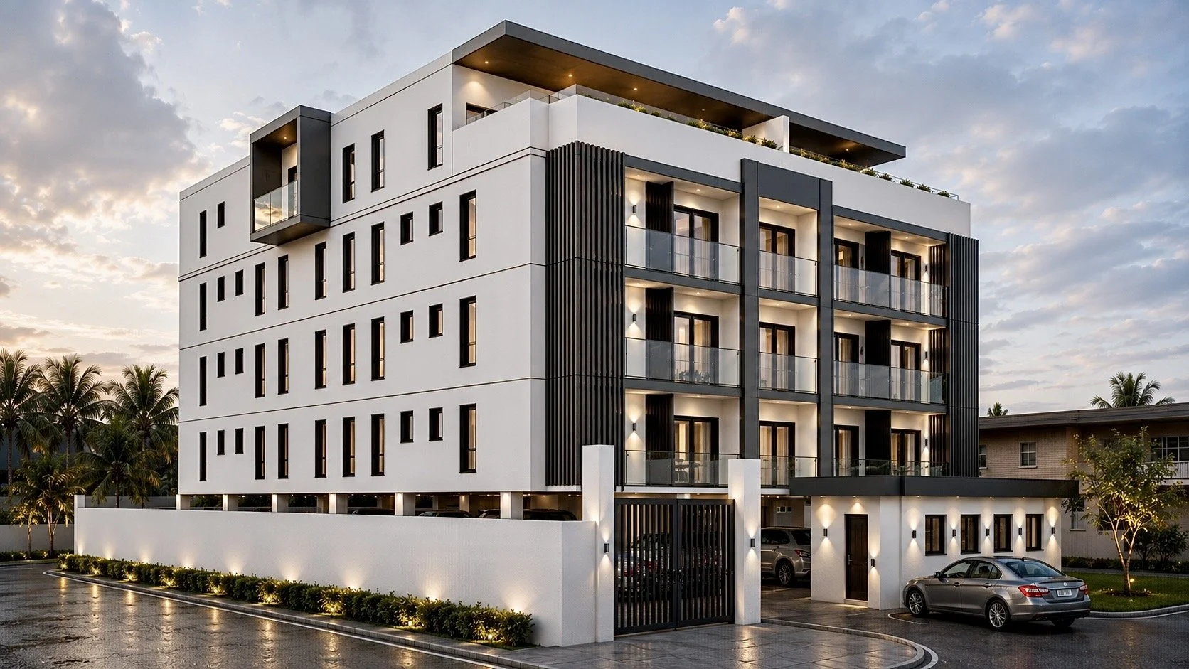 Modern multi-story apartment building with balconies and black vertical accents, illuminated exterior lighting, cars parked in front, palm trees in the background, during dusk, designed by IHOD.