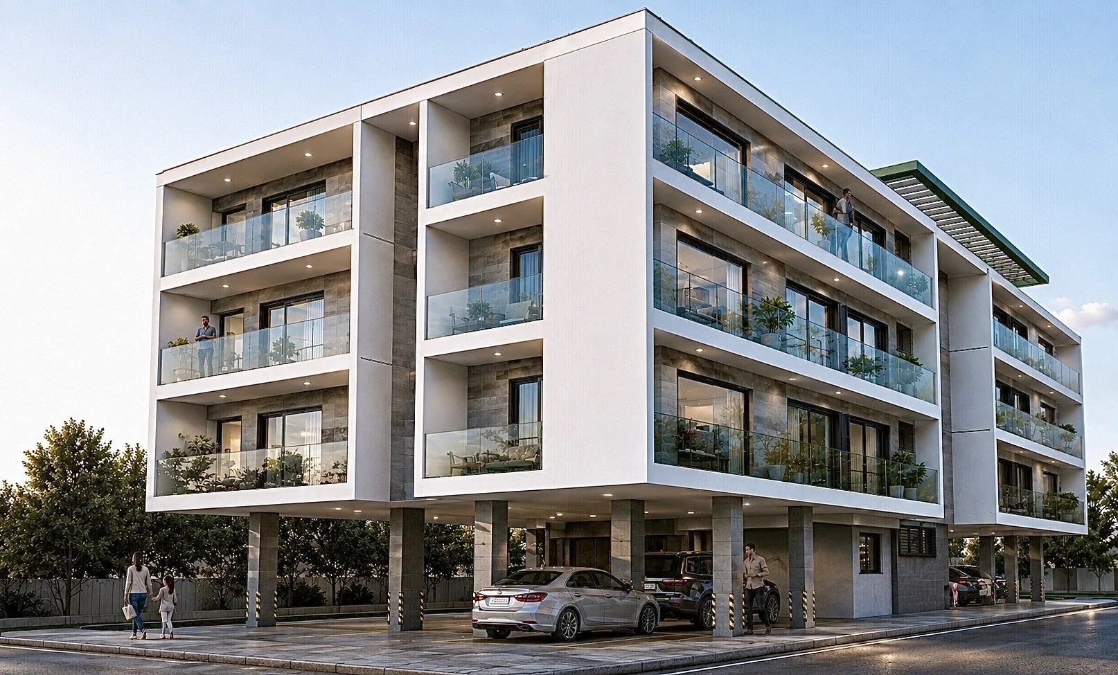 Modern four-story apartment building with glass balconies, several people on balconies and outside, cars parked underneath, trees and a clear sky in the background.