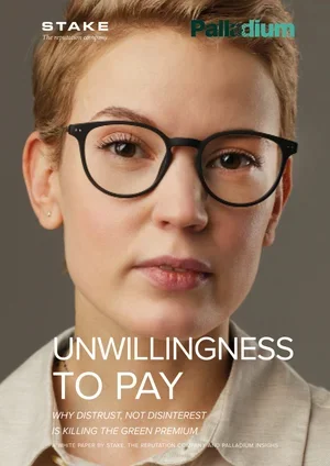 Close-up of a woman wearing black glasses and a white shirt, with short blond hair, on the cover of Palladium magazine, featuring the headline 'Unwillingness to Pay'.