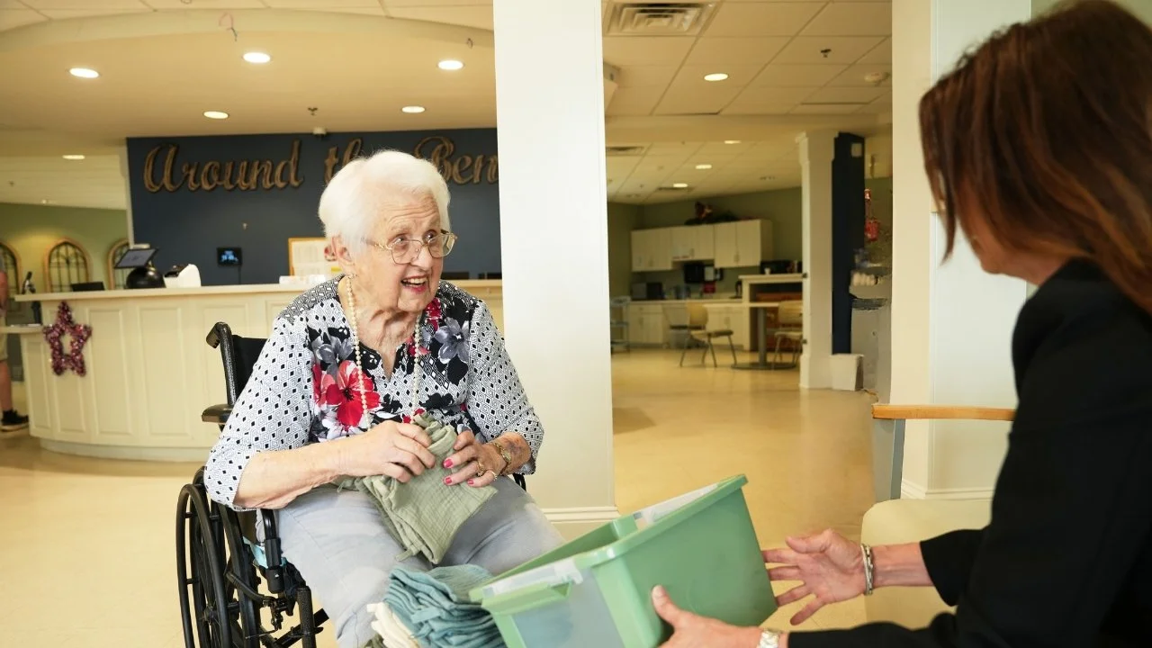 resident enjoying attention during memory care activity