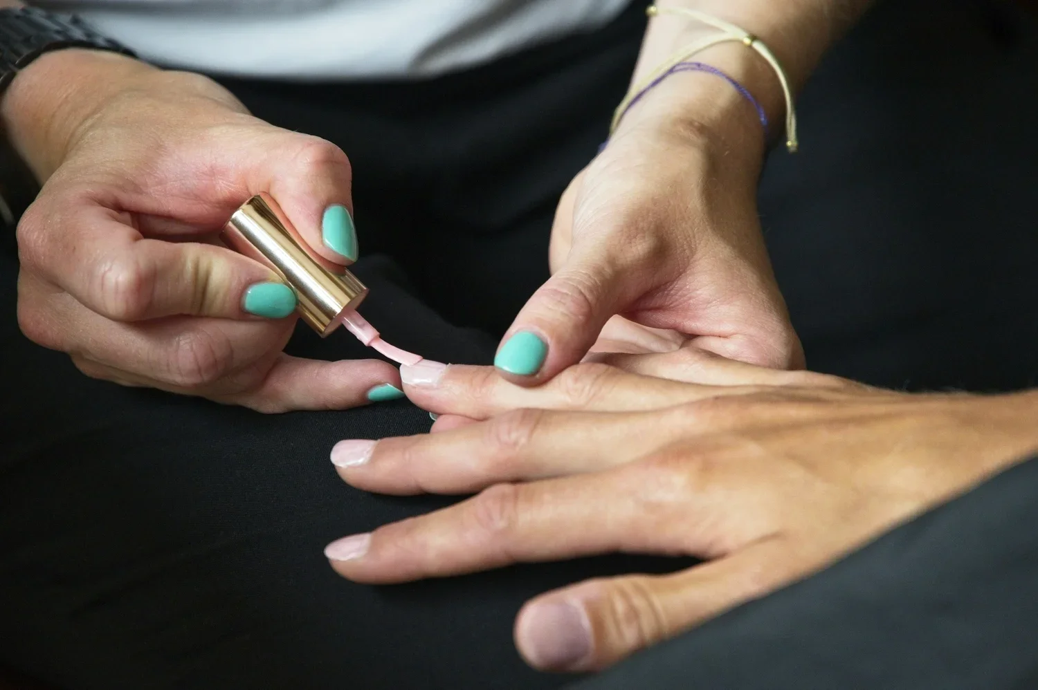 closeup shot of hands getting a manicure