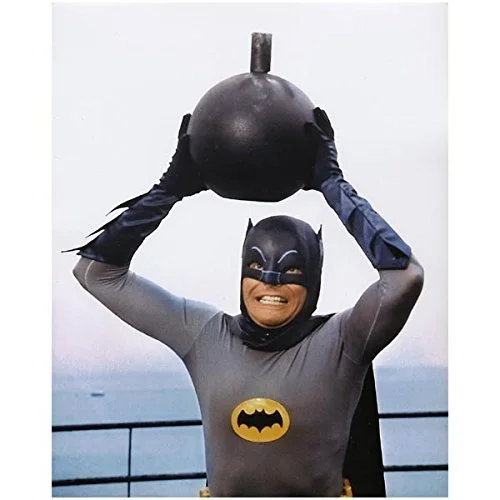 Adam West Batman holding a large bomb