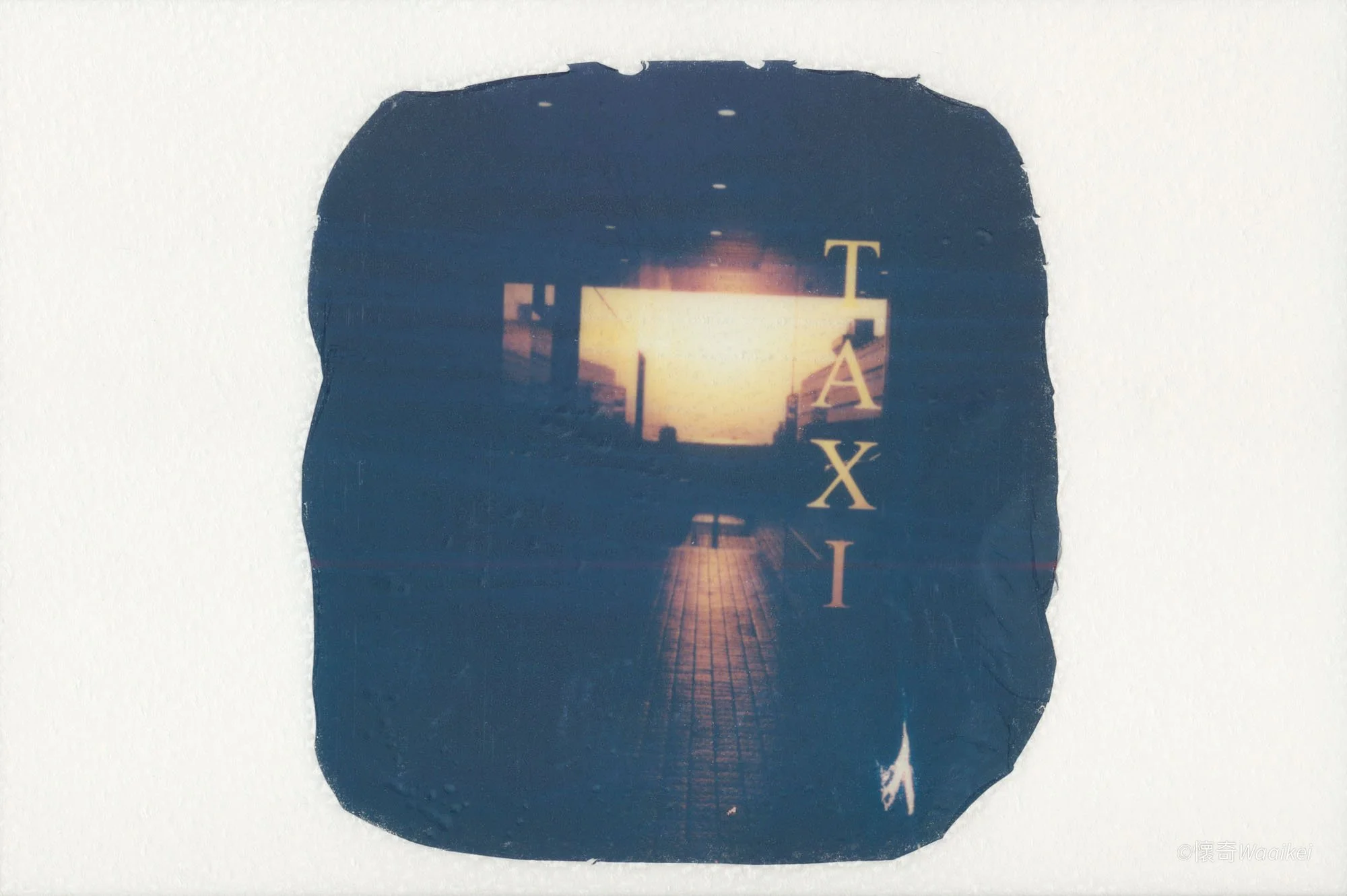 A silhouette of a person's head with an image of a sunset or sunrise scene and partial text 'TAXI' inside it.