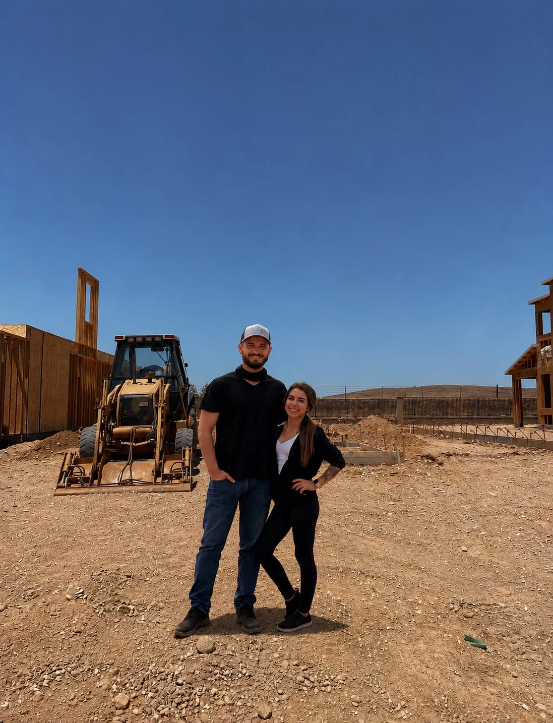 Founders of Well, Lived Home standing on the future site of their own home project in Central California.