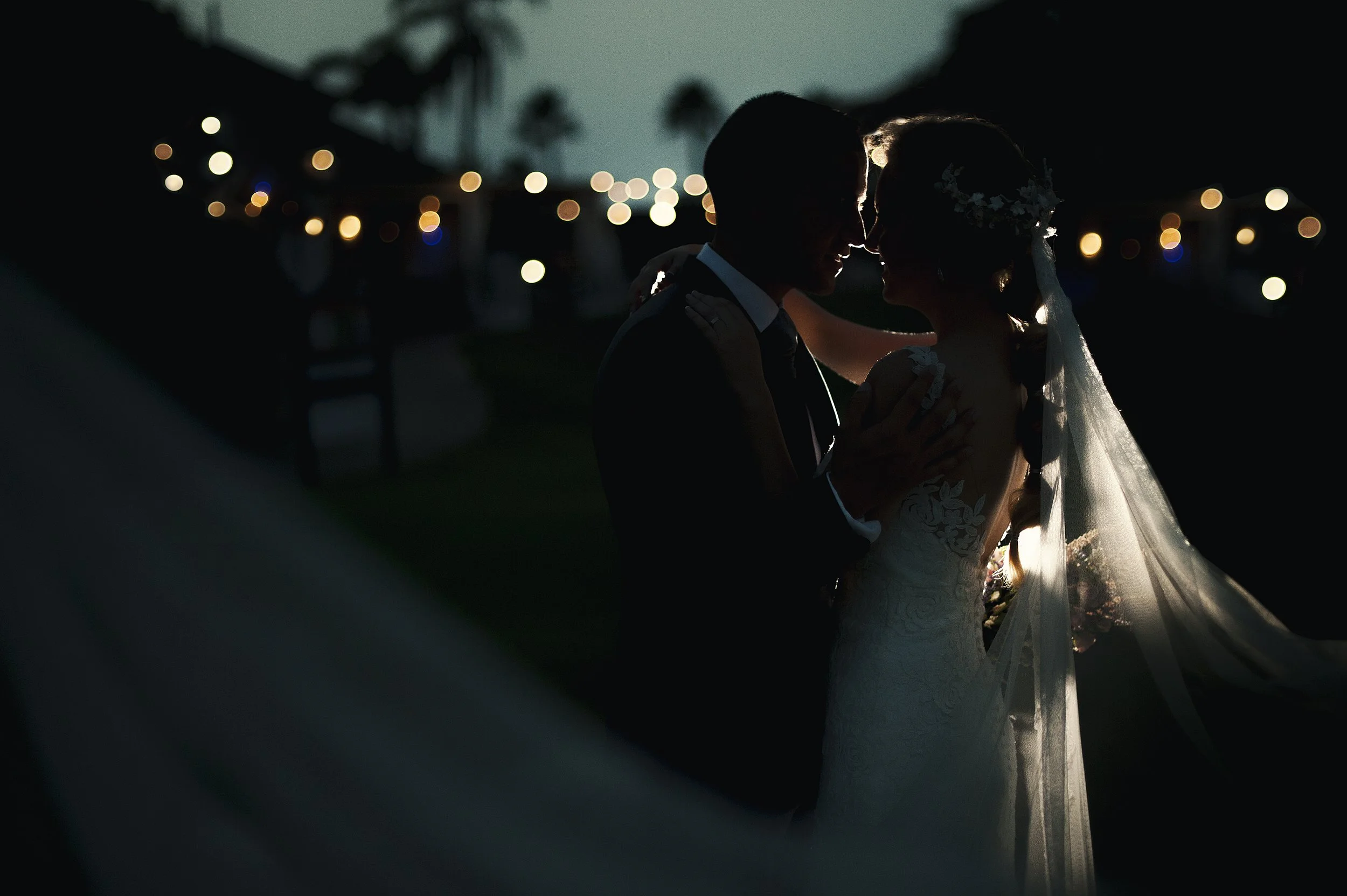 couple-embrace-on-wedding-day-under-evening-lights-2026-01-09-09-01-19-utc.jpg