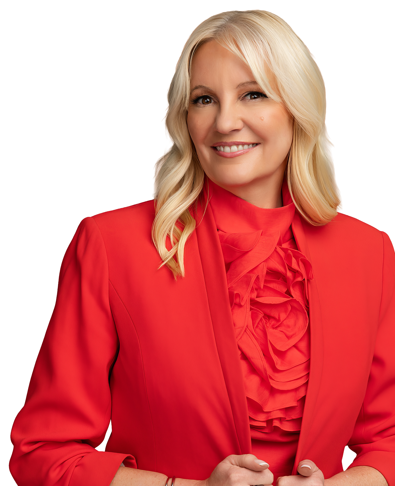 A woman with blonde hair wearing a red blazer and ruffled blouse, smiling and facing slightly to the right.