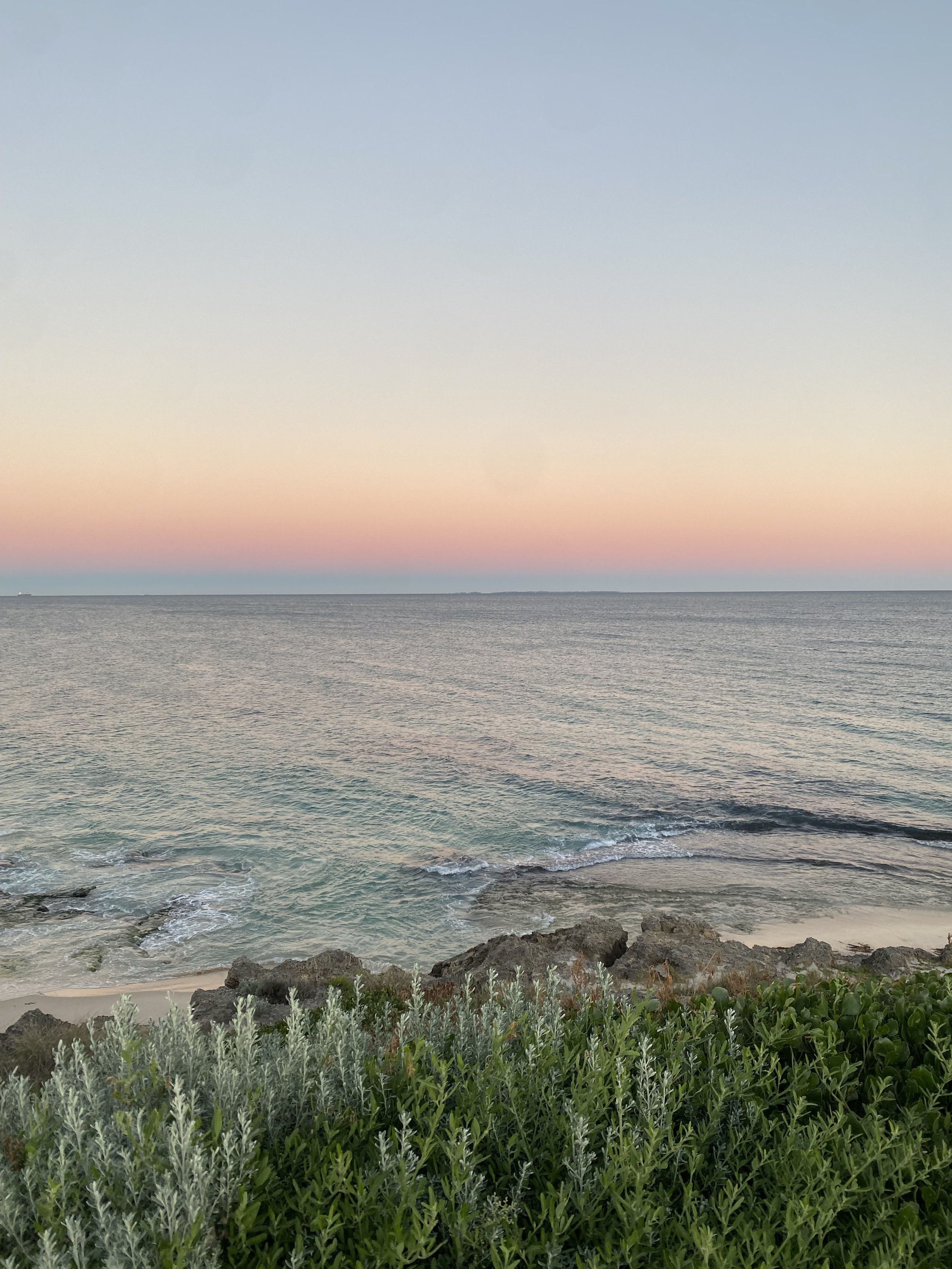 Image of a coastline at sunrise