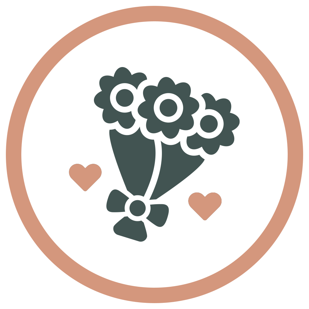 A circular badge featuring a gift box with flowers and two small hearts.