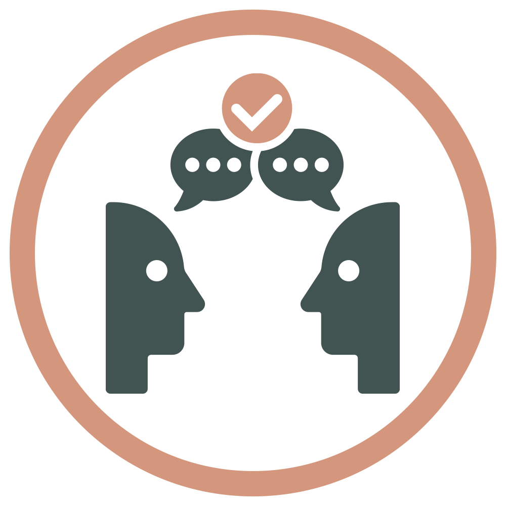 Two abstract human faces facing each other with speech bubbles above, one with a checkmark, inside a circular border.