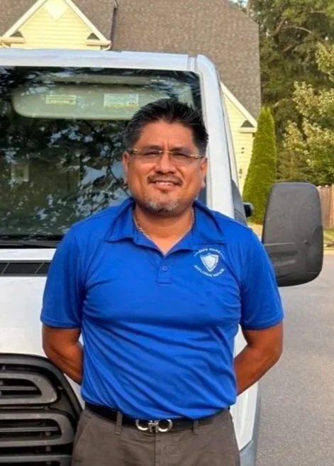 Miguel Lazo, owner of Safe Home Appliance Repair, standing in front of his service van