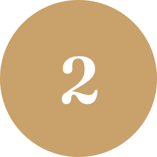 A beige circle with the number 2 in white in the center.