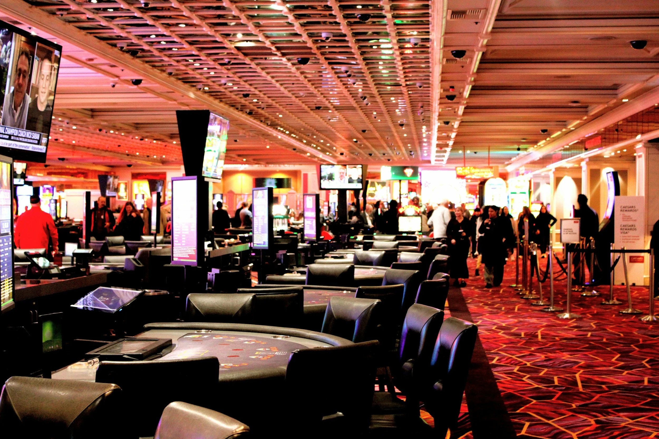 Gaming venue floor with tables and electronic displays