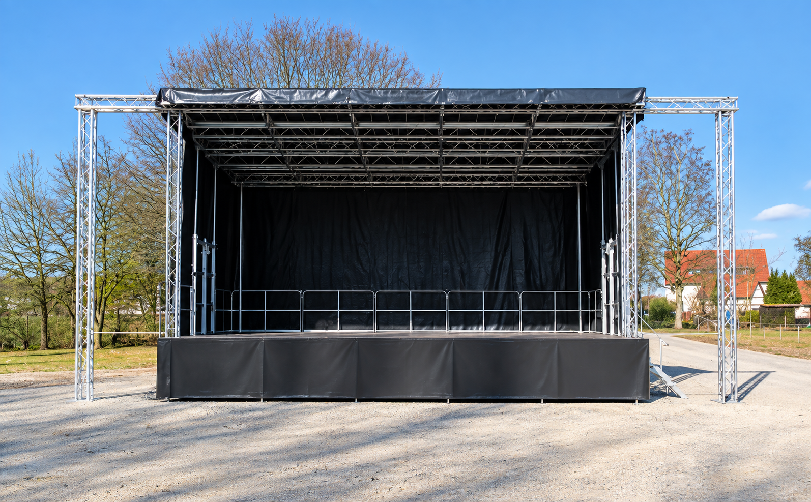 Stage Mobil XXL mobile outdoor stage with large black canopy, professional aluminium truss structure, black stage skirting, safety railings and backdrop, ideal for festivals, concerts and outdoor events.