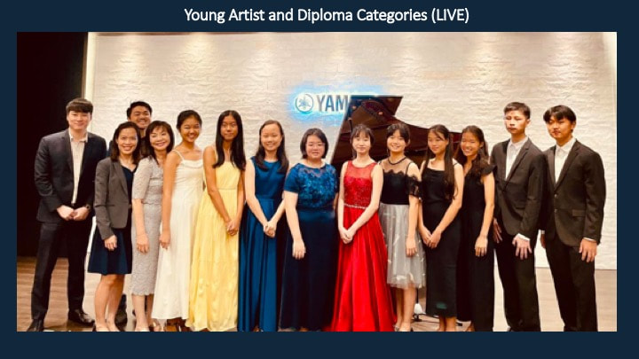 Group of young students in formal dresses and suits posing on stage at a live competition titled "Young Artist and Diploma Categories," with a grand piano and Yamaha logo in the background.