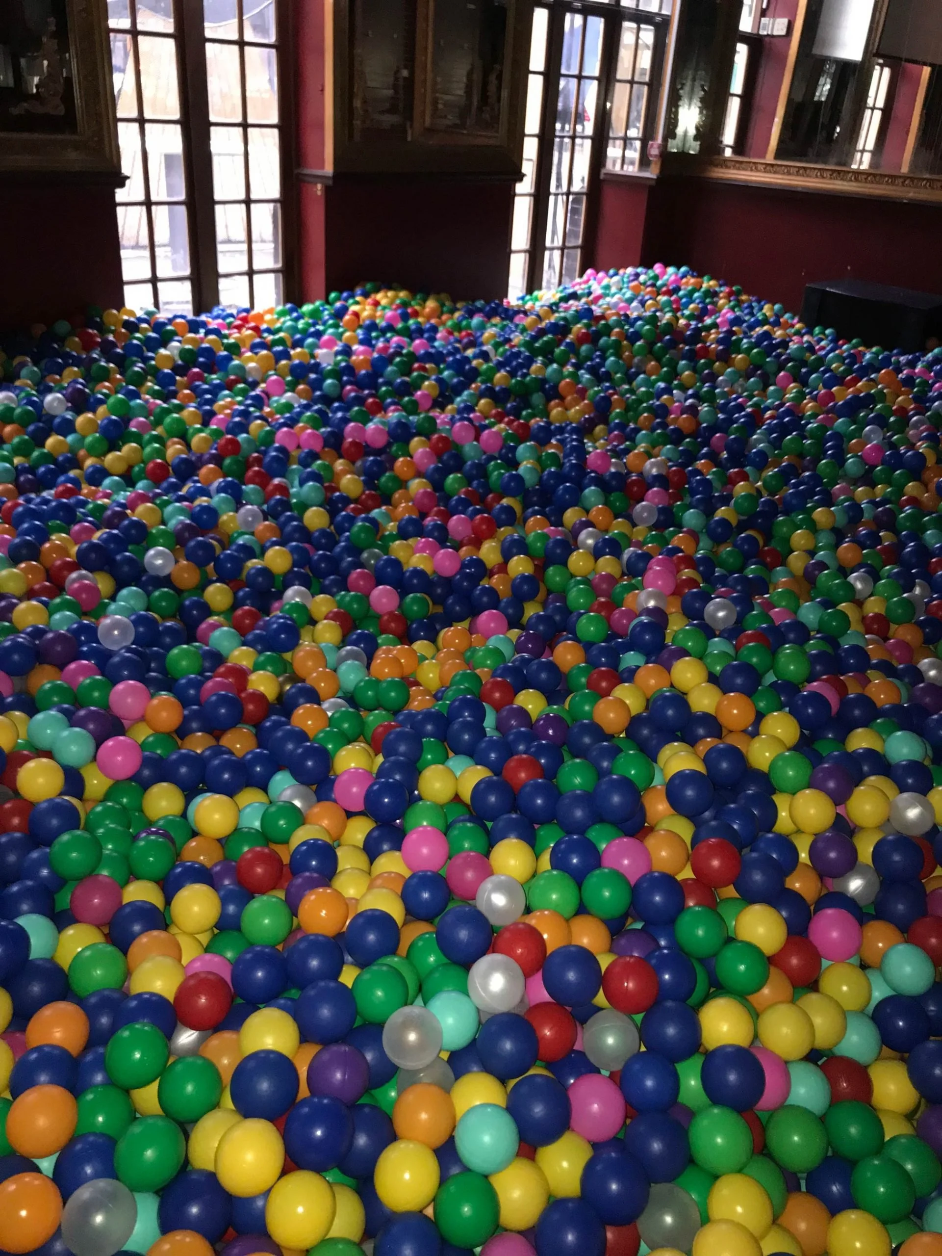 Close-up of a deep room fill of multicoloured ball pit balls