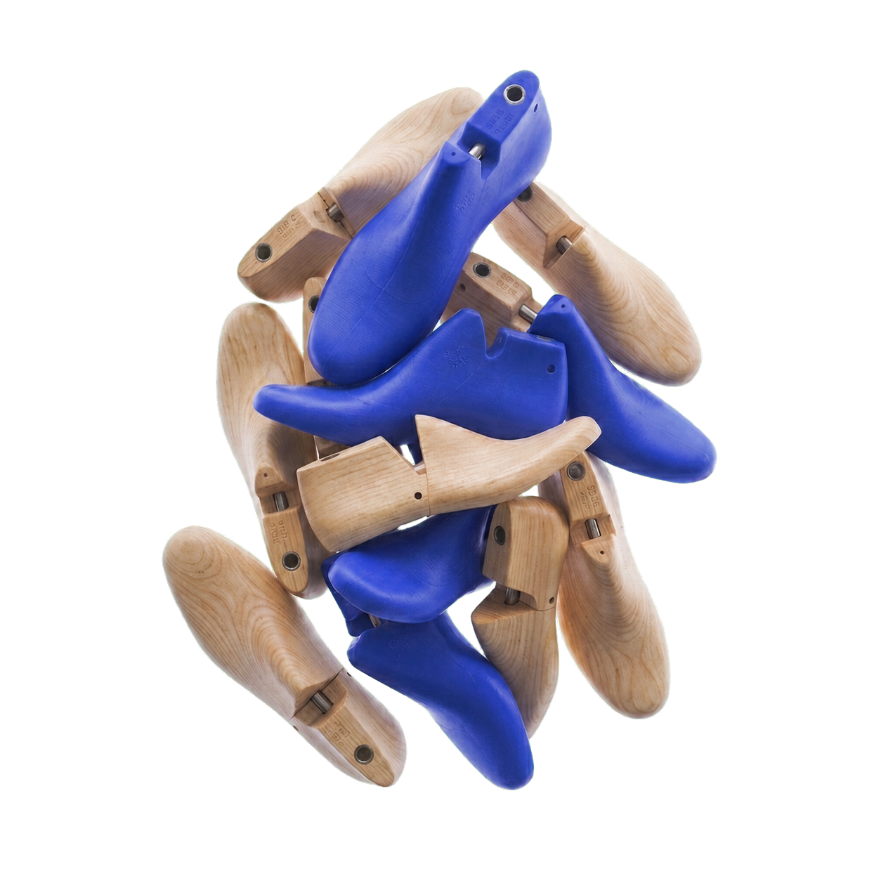 A pile of wooden and blue plastic shoe lasts arranged in a disorganized manner.