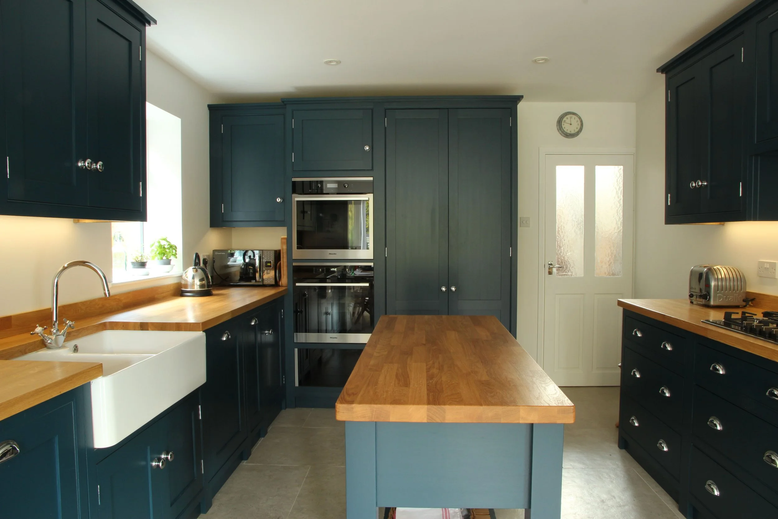 Blue painted kitchen with Oak worktops