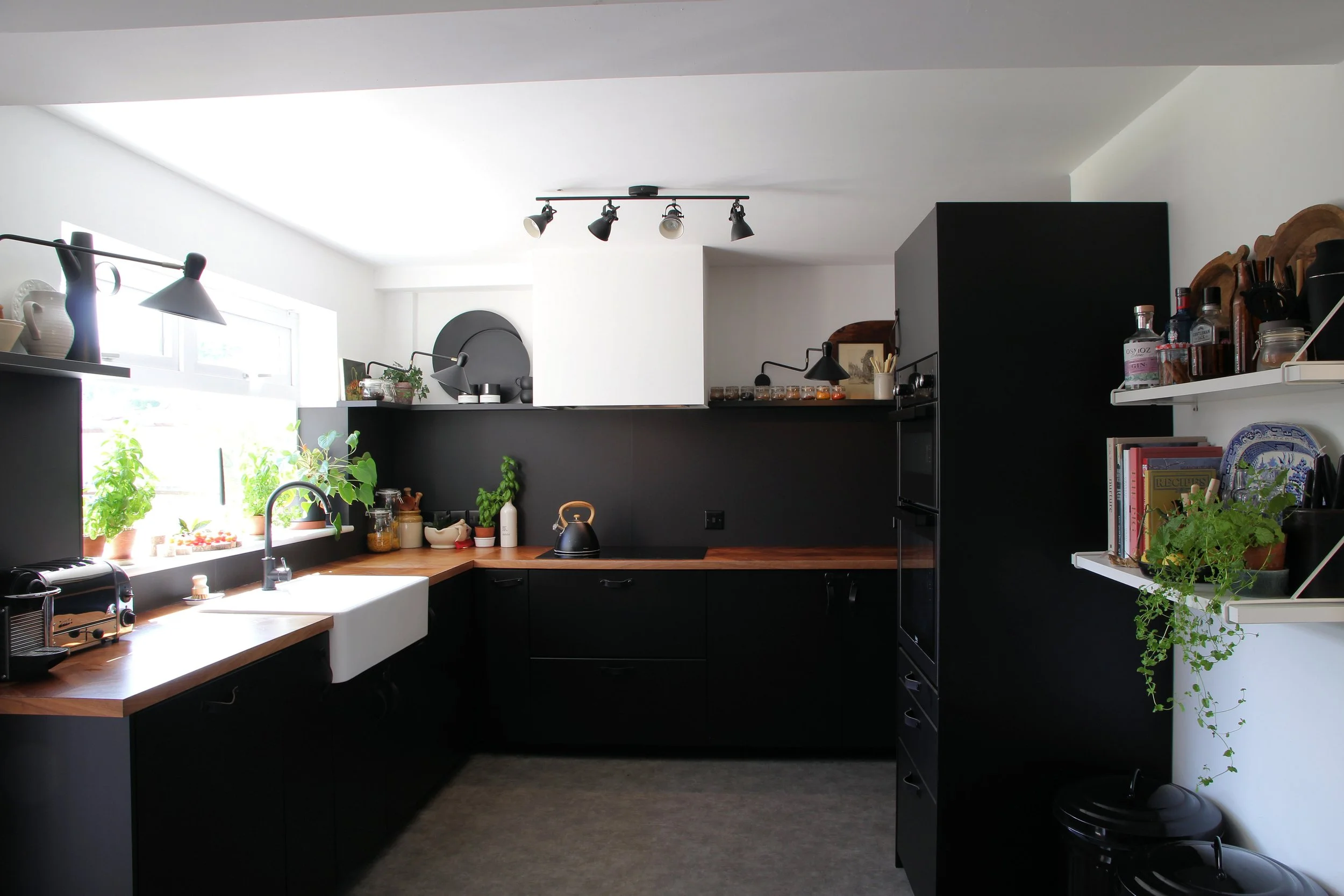 Black laminated kitchen with Walnut worktops.