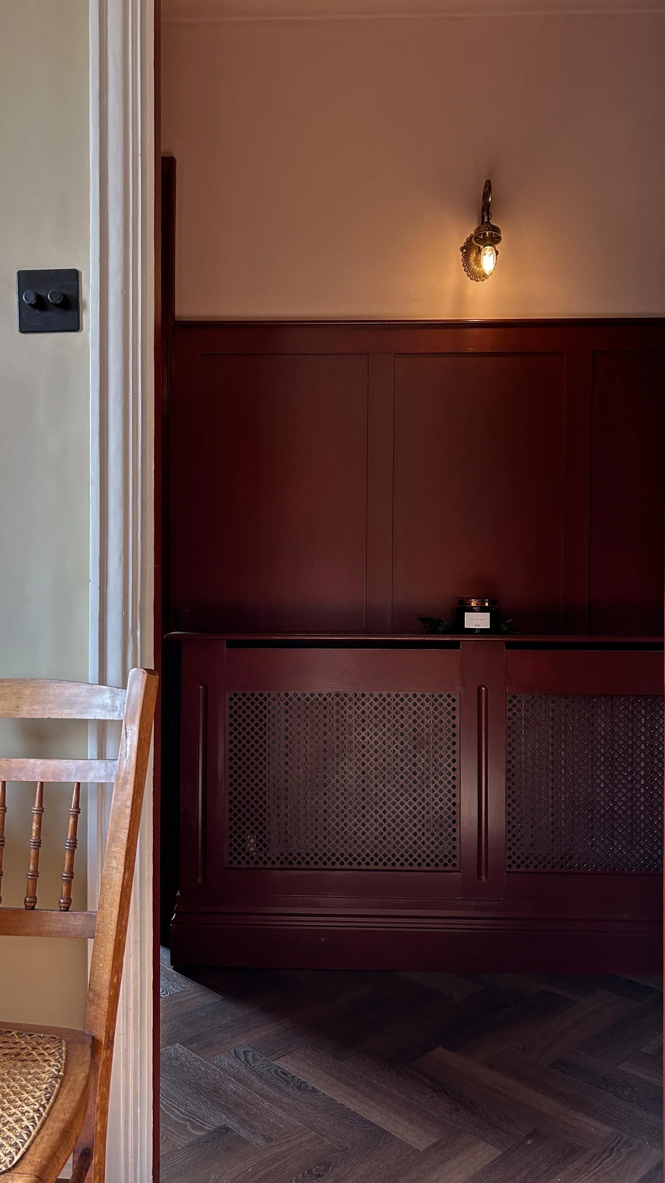 Wood panelling and radiator casing.