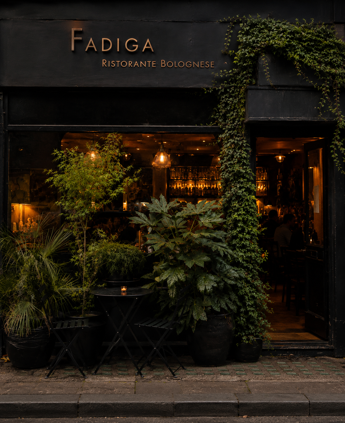 Exterior of Fadiga Bolognese Restaurant in Soho, London, with a welcoming entrance, outdoor plants and warm lighting in the heart of London's West End.