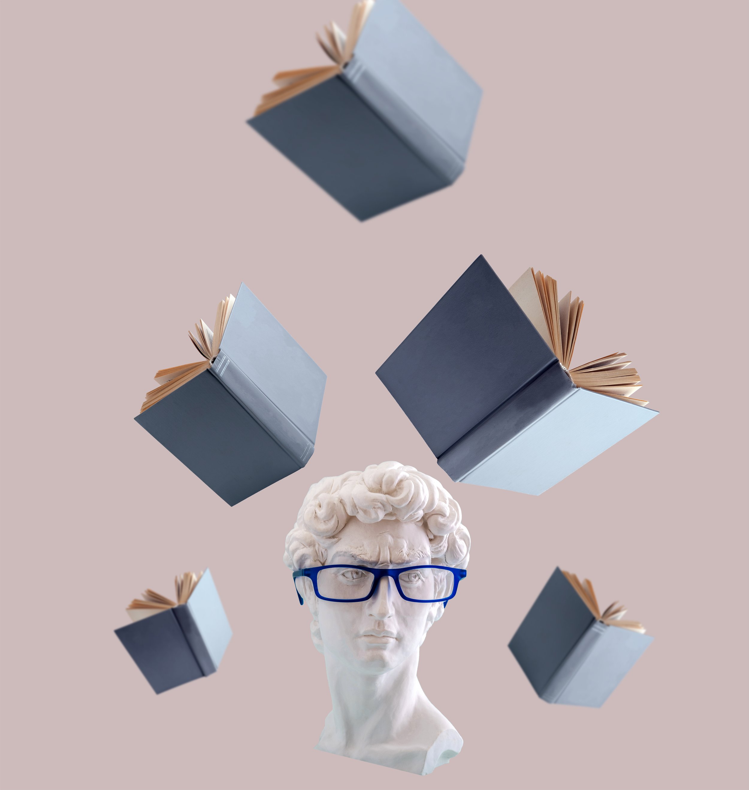 Stack of four books floating in midair above a human bust sculpture wearing glasses, with a pink background.