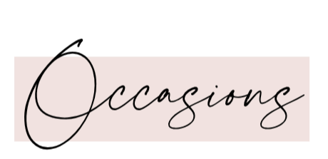 Close-up of a sign reading 'Occasions' in elegant black cursive font on a light pink background.
