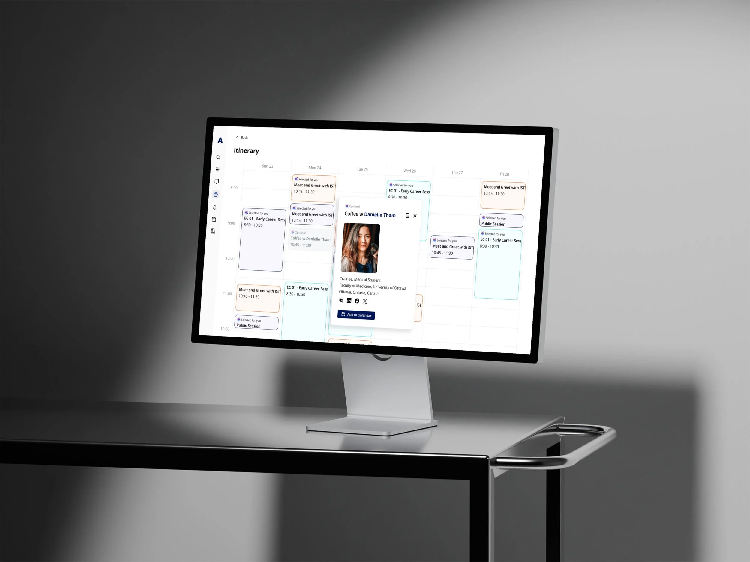 A computer monitor displaying a weekly calendar schedule with various appointments, including meetings, sessions, and a profile picture of Danielle Tham.