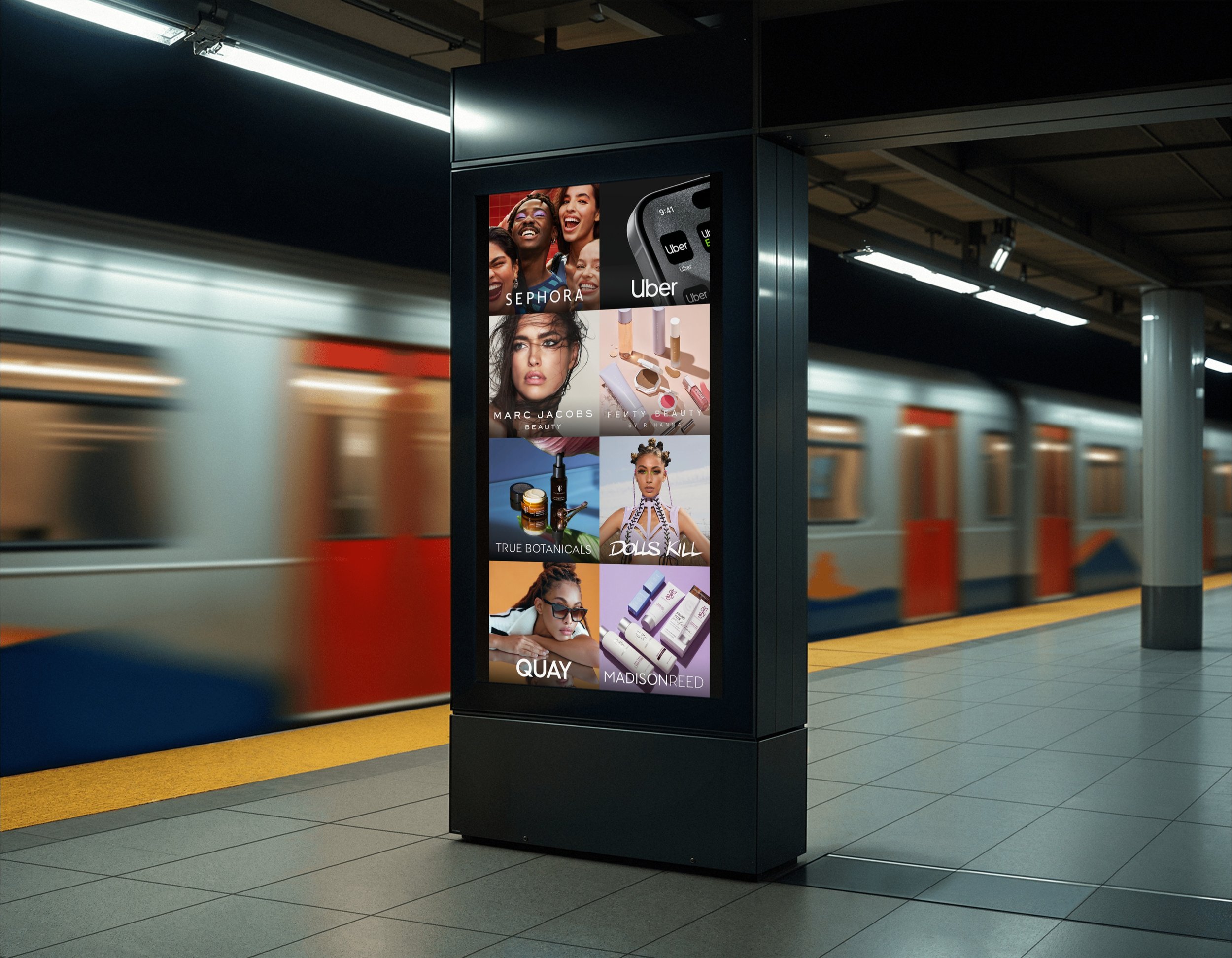 Digital advertisement display in subway station featuring images of beauty and skincare products, makeup, and diverse women, with brand names such as Sephora, Marc Jacobs, Fenty Beauty, Dolls Kill, Madison Reed, and others.