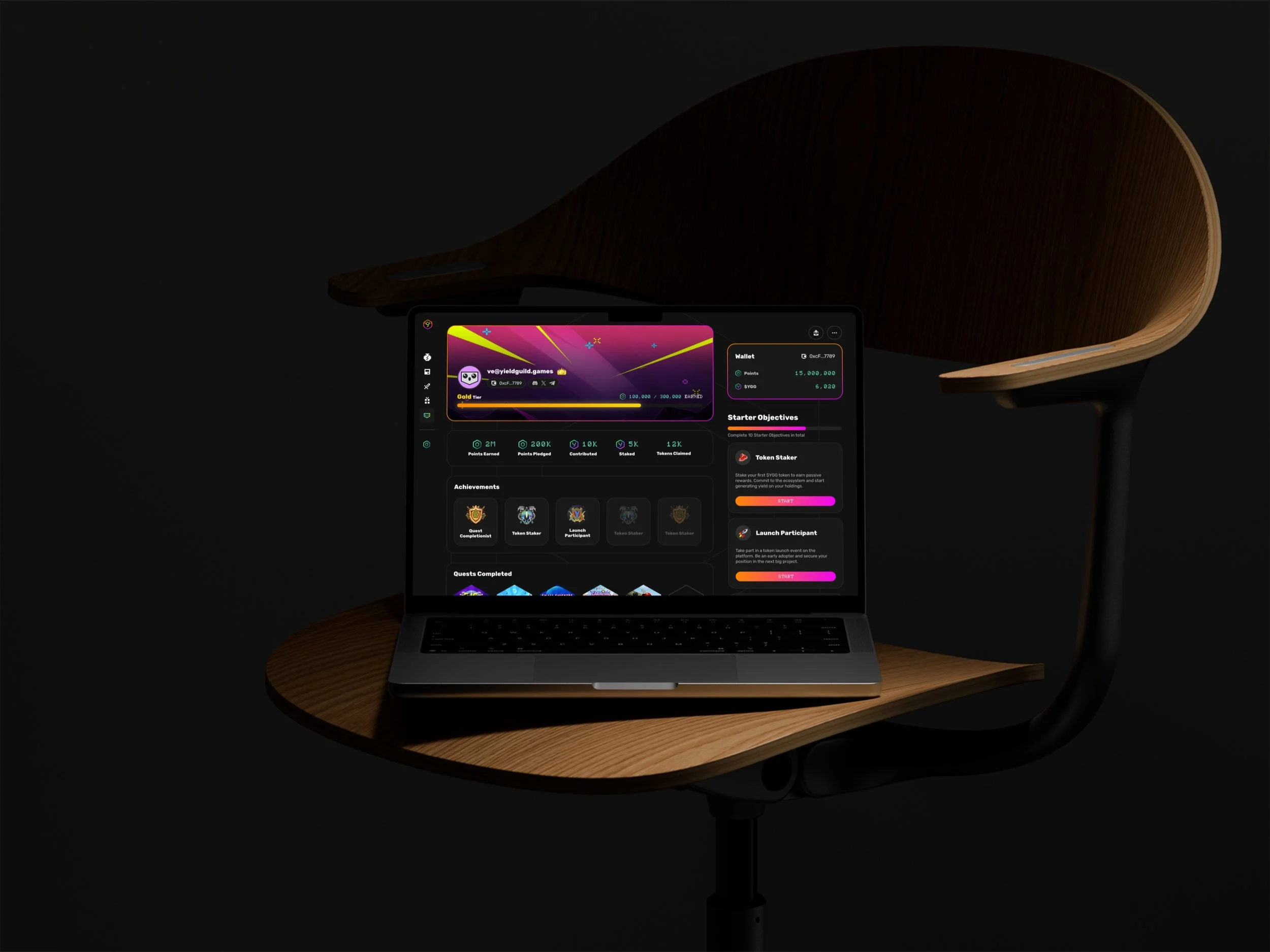 A laptop on a wooden table displaying a cryptocurrency or gaming app interface in a dimly lit room.