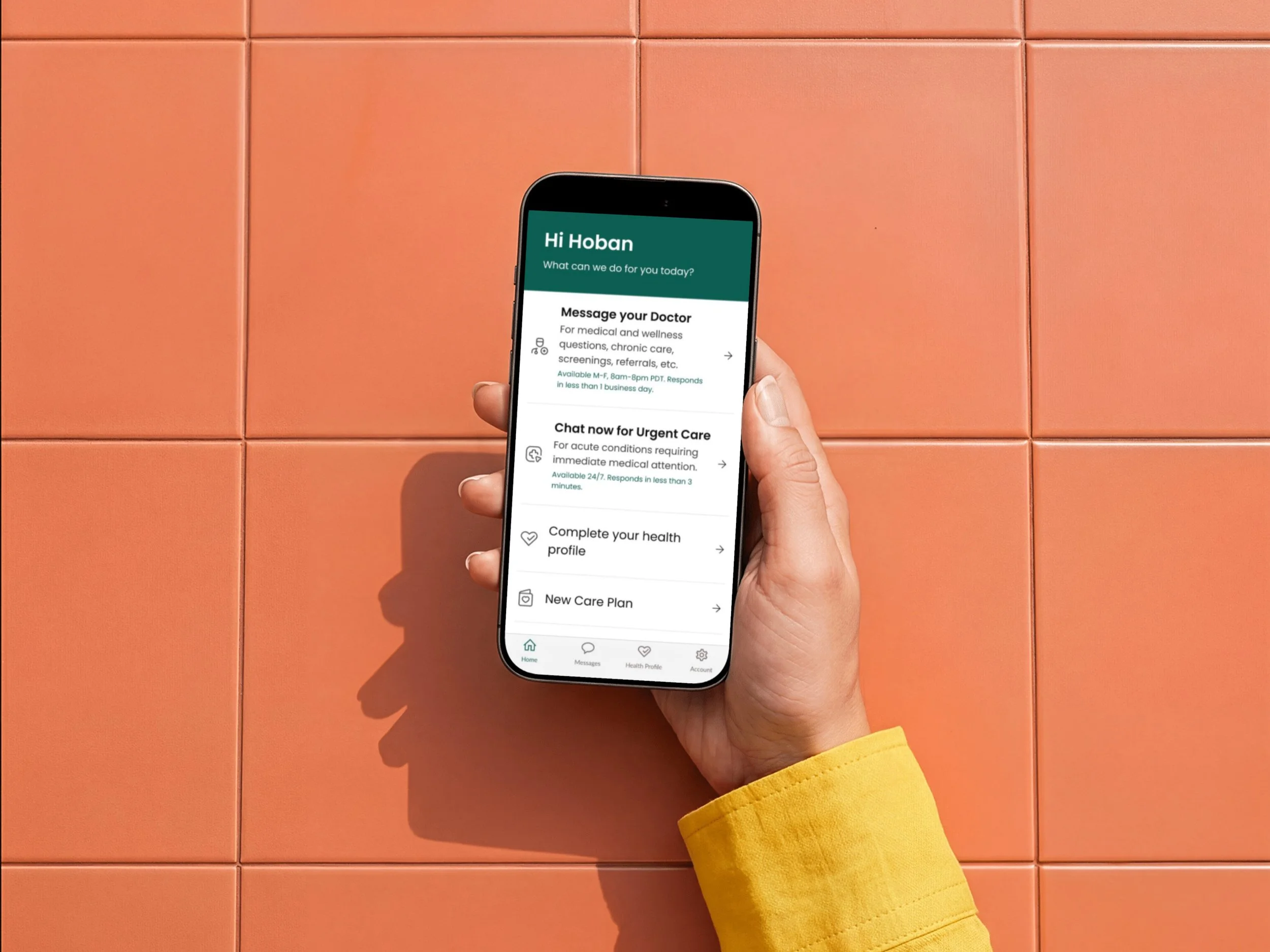 A person with a yellow sleeve holding a smartphone displaying a health app against a tiled orange wall.