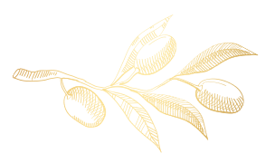 A gold-colored pen with a black tip on a black background.