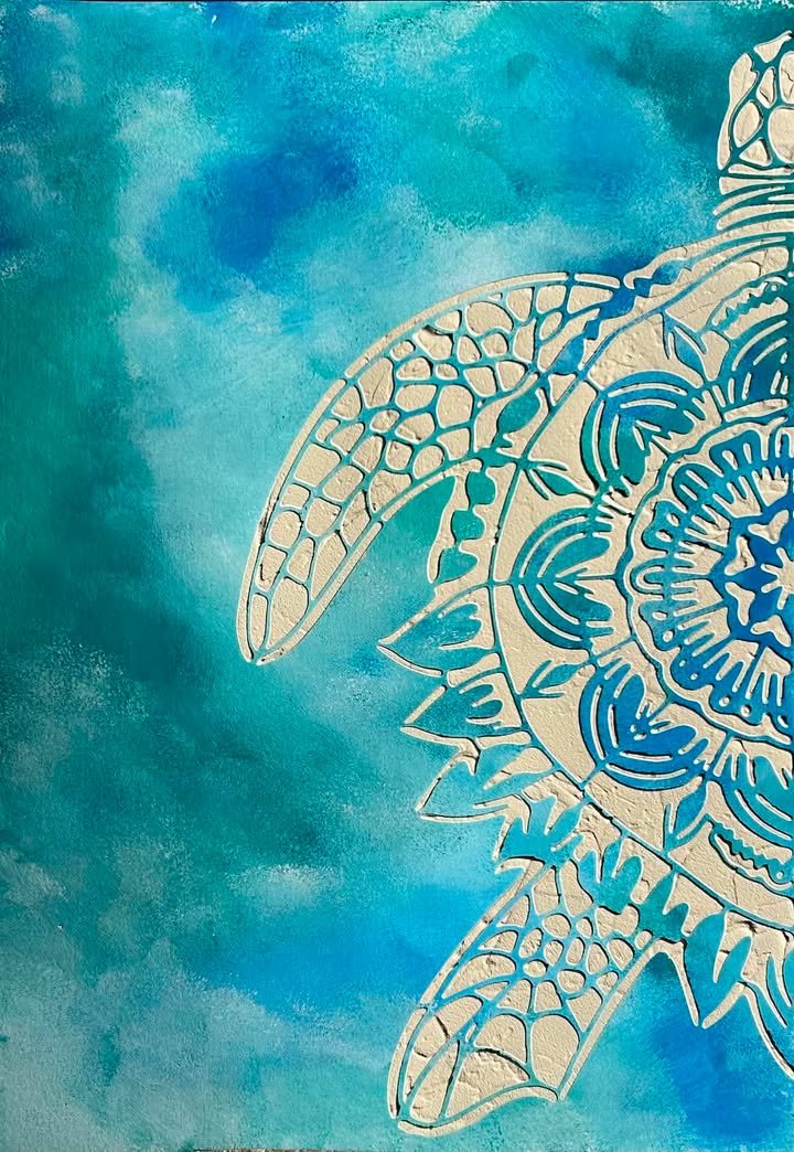 Close-up of a decorative paper cut-out of a starfish and intricate patterns on a blue textured background.