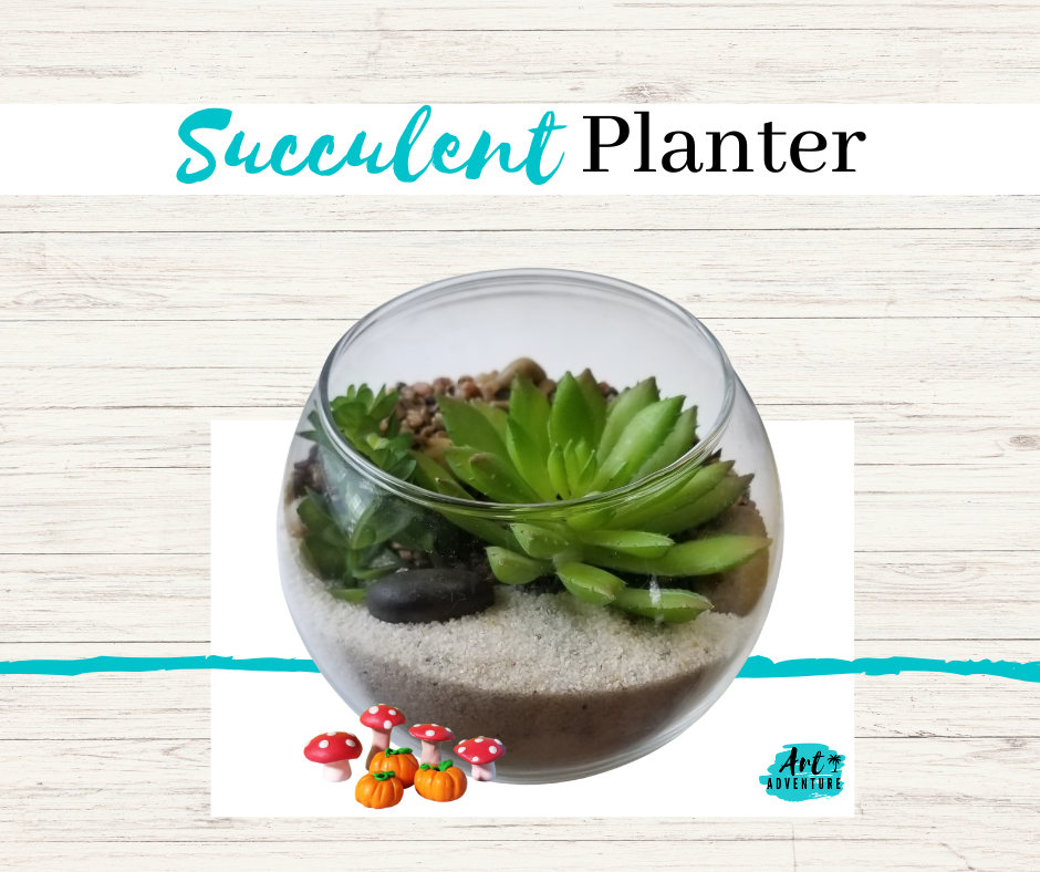A round glass succulent planter with green succulents and black decorative rocks on soil, on a wooden background with text 'Succulent Planter' at the top and small mushroom and pumpkin decorations at the bottom.