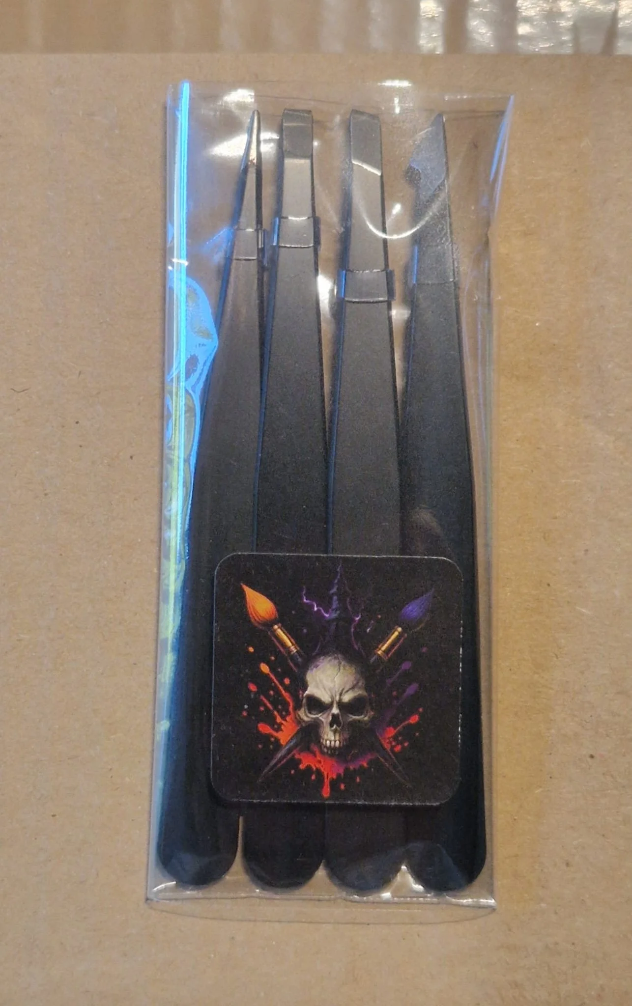 Four piece model grip tweezer