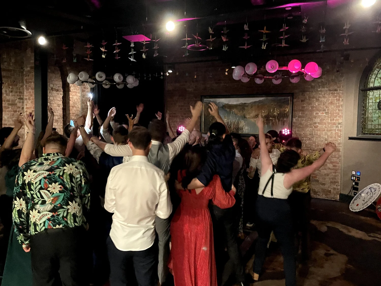 Celebration lighting and dance floor at a wedding
