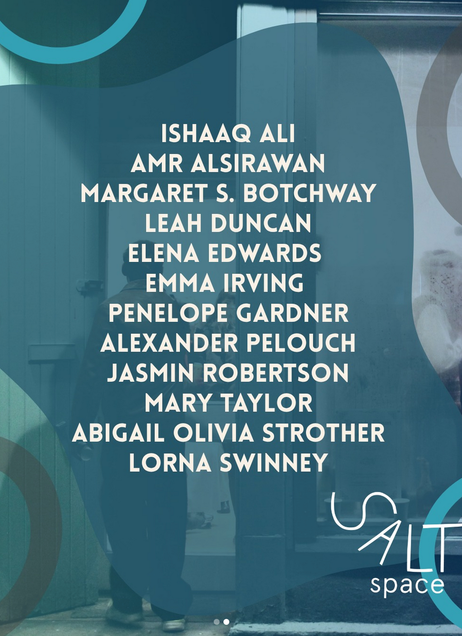 Names of individuals listed on a glass door or window with reflections visible in the background.