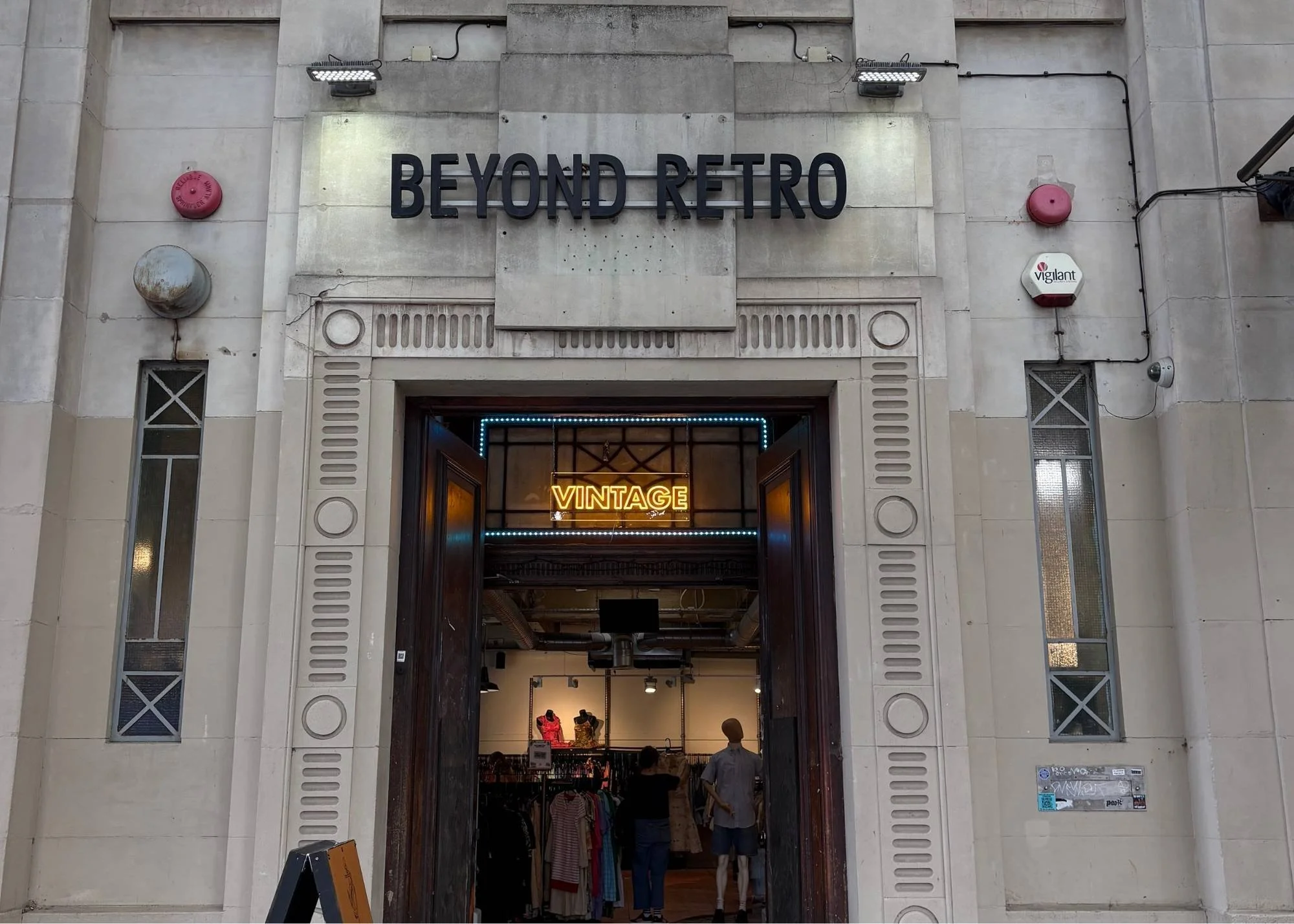 Entrance to Beyond Retro Dalston, London location with a vintage clothing sign.