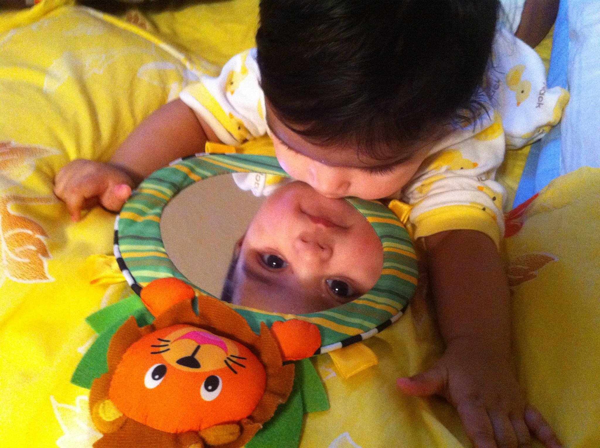 Happy infant during a pediatric telemedicine visit with 210 Pediatrics.