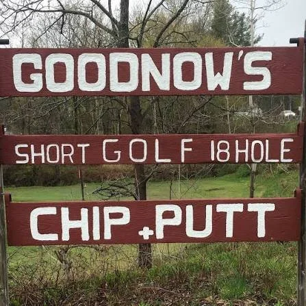 A sign for Goodnow's with additional instructions about their golf course, mentioning a short 18-hole golf course and a chip and putt area.