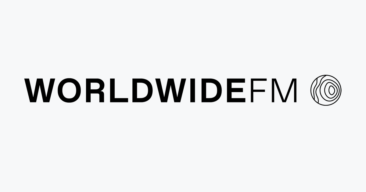 Logo of Worldwide FM with a black and white circular graphic on the right.