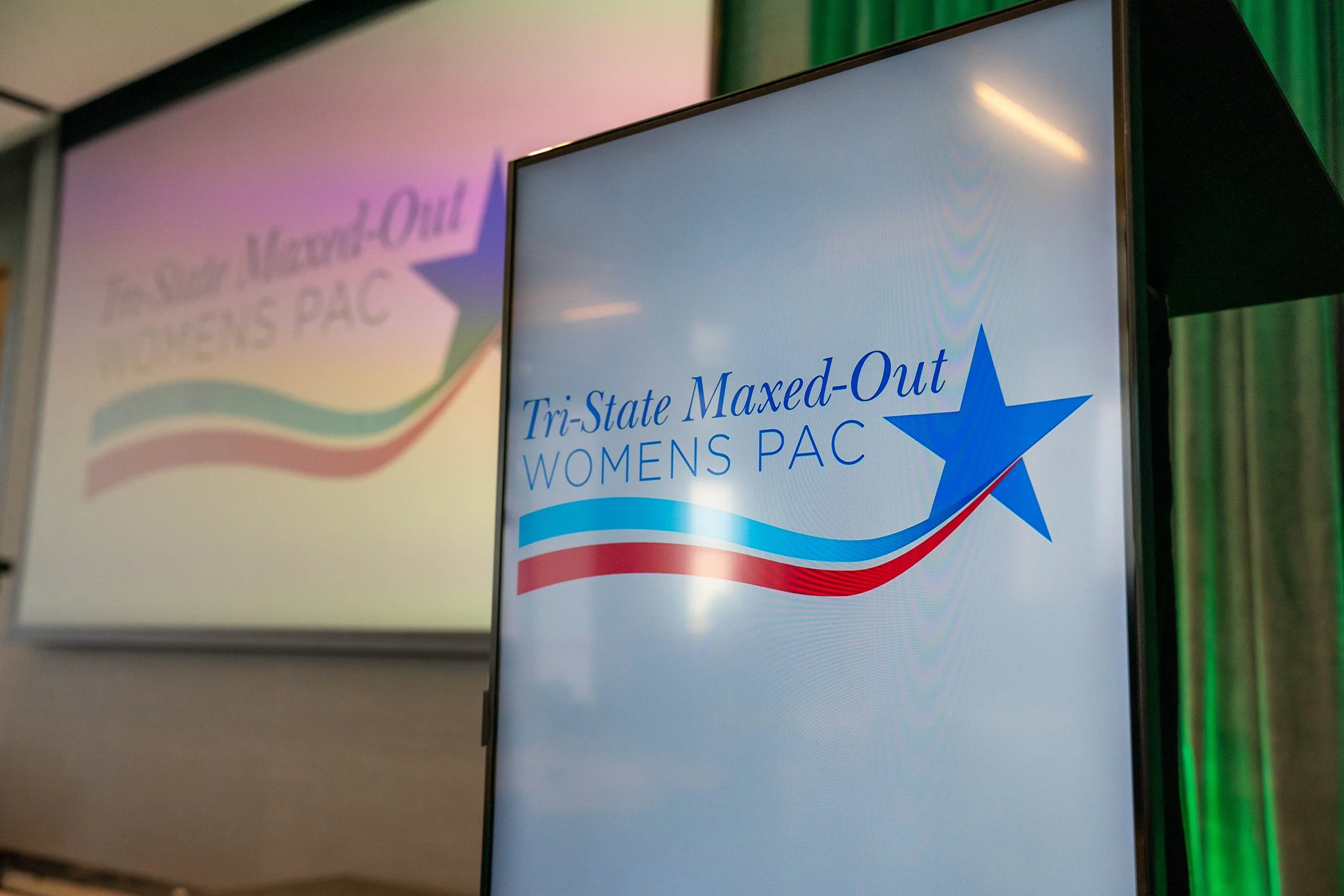 Tri-State Maxed-Out Womens PAC logo displayed on screens at the 2025 Annual Luncheon.