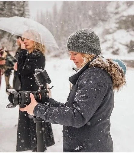 Natalie Winters capturing a wedding, reflecting her background in photography and visual storytelling.
