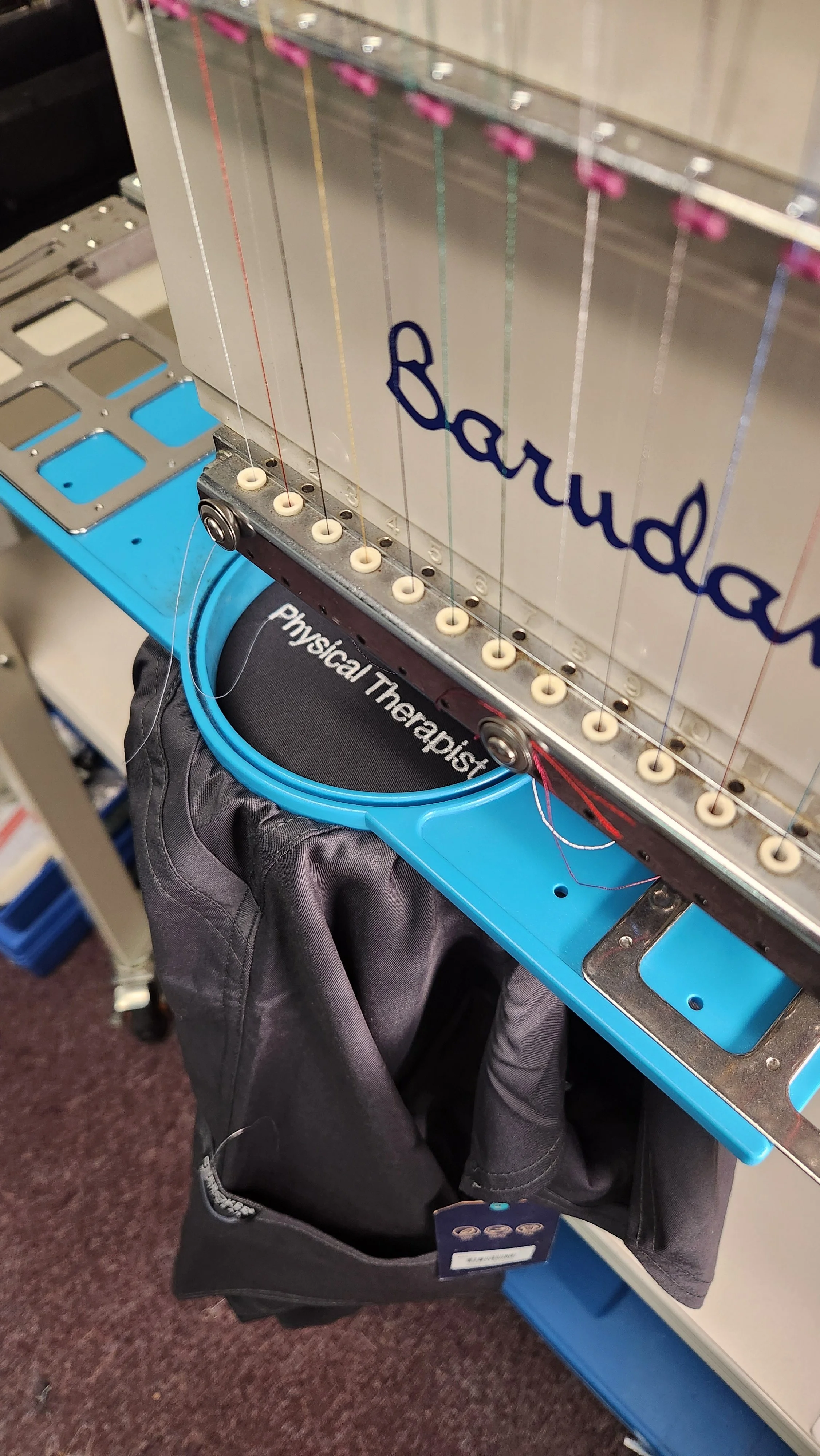Embroidered medical scrub with custom logo and professional credentials