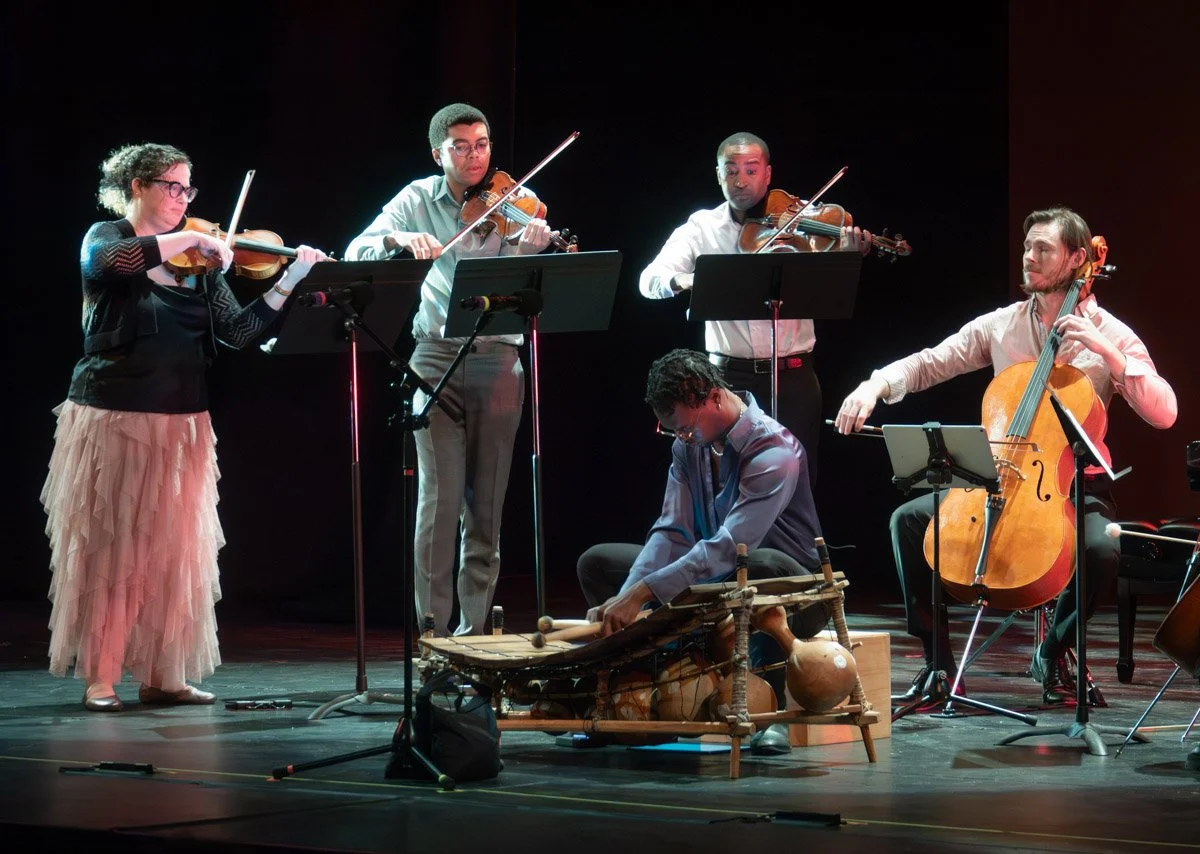 Nicholas Johnson, cellist, playing with Boston Public Quartet and Steph Davis playing gyil at the Strand Theatre in Dorchester