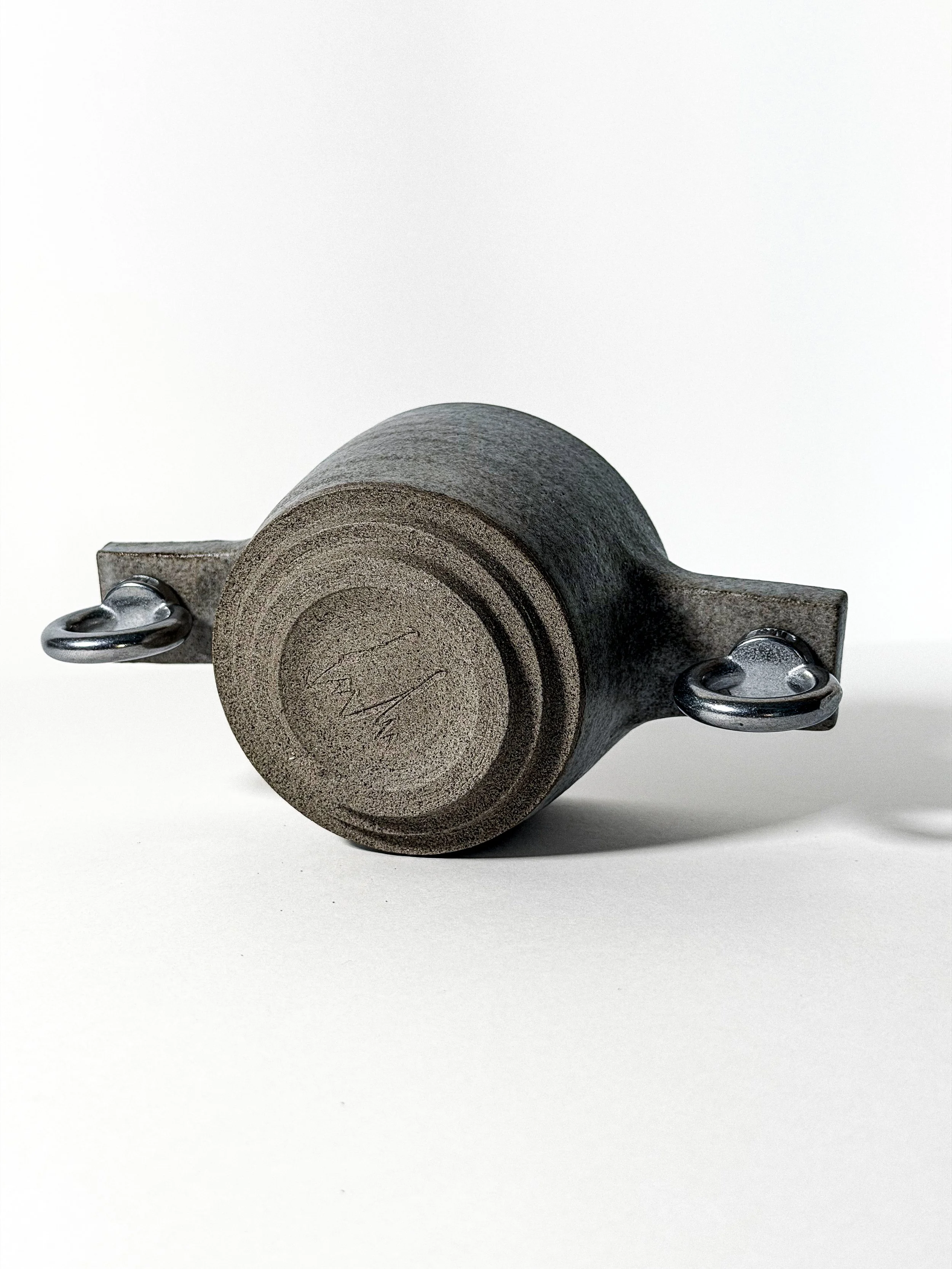 brutalist love cup underside with stepped foot and eye-bolt handles