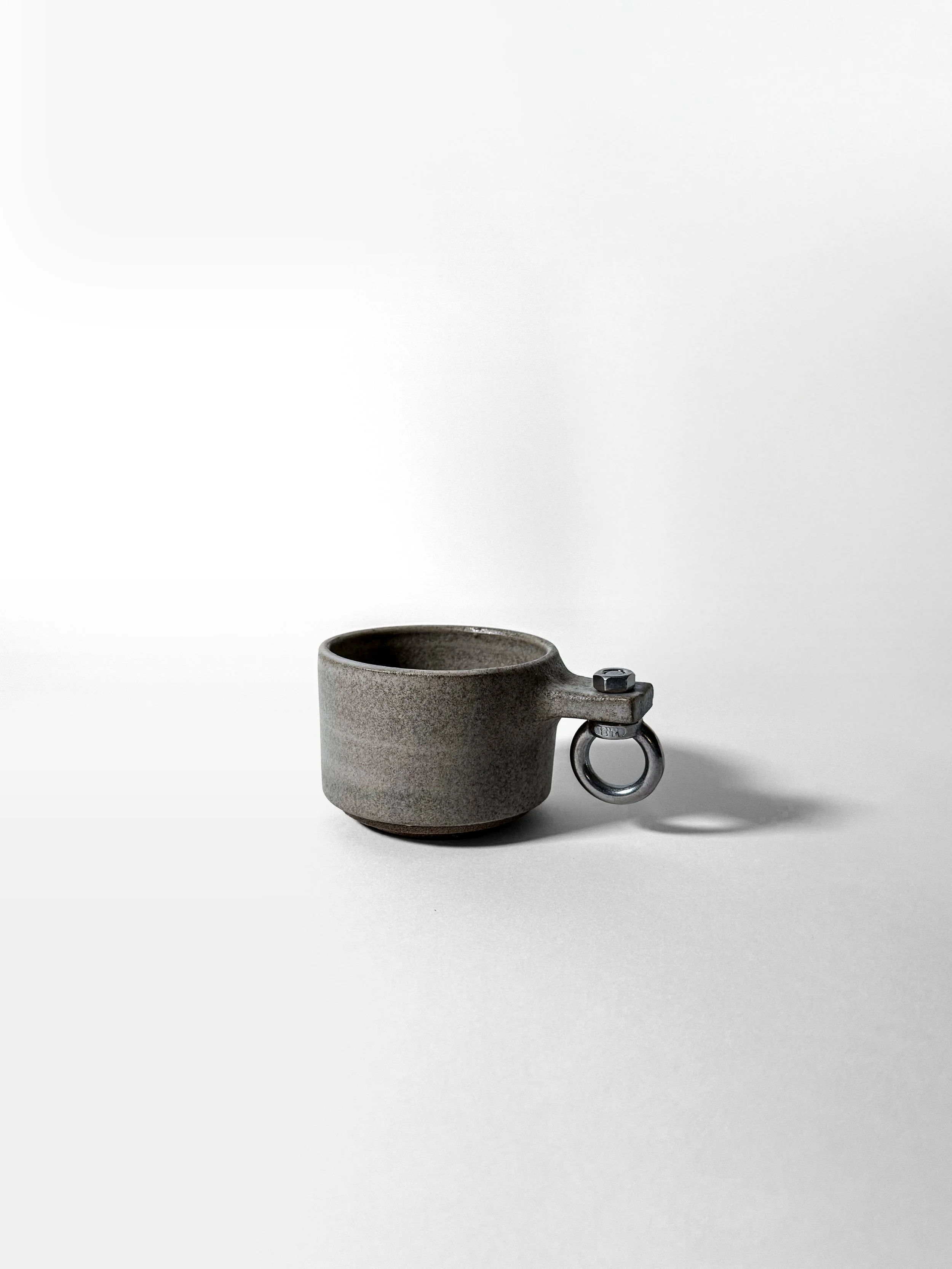 brutalist cup 01 loop in grey stoneware with stainless steel eye-bolt loop handle, side view