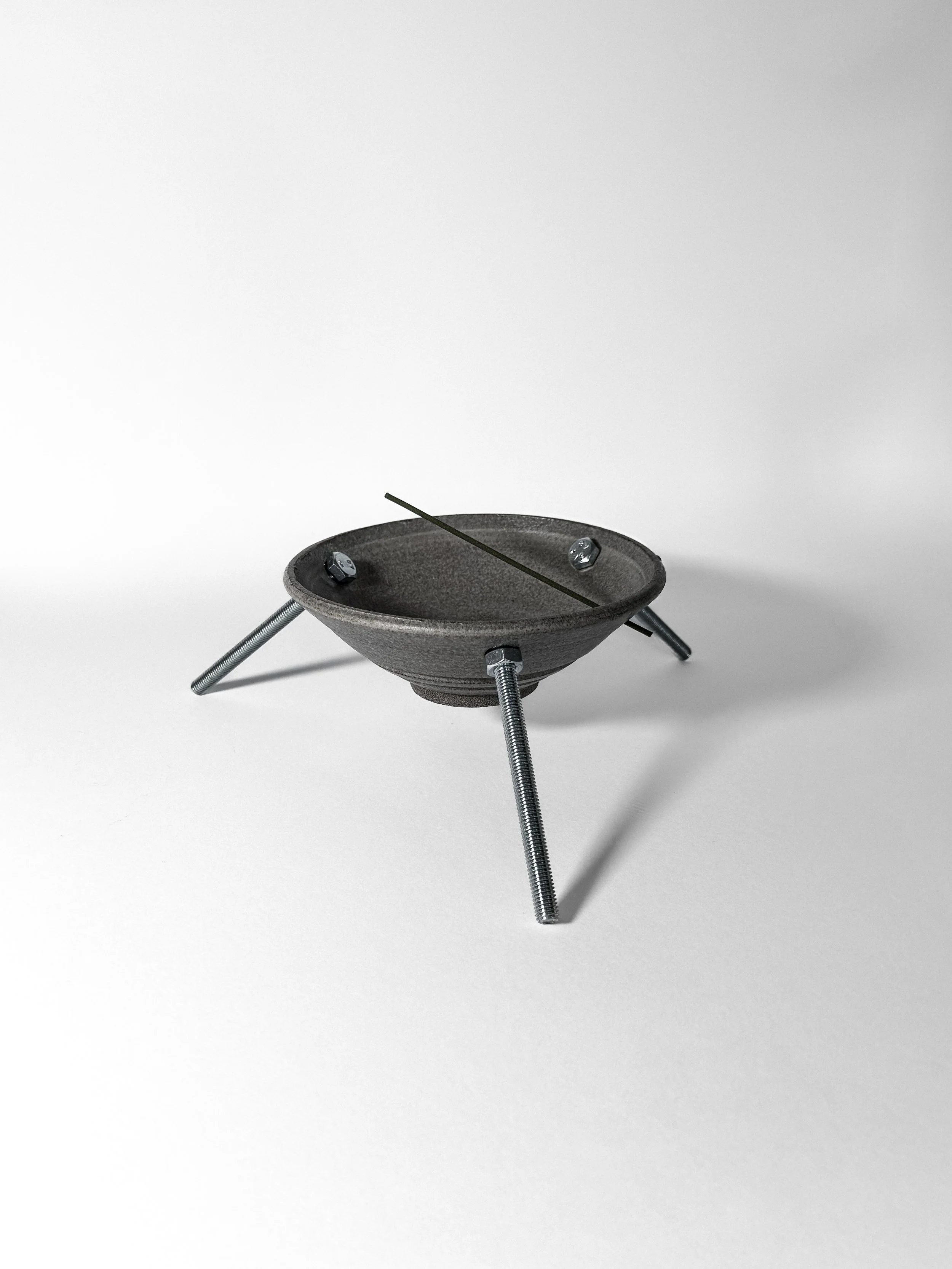 brutalist ritual 01 stoneware incense holder on three stainless steel legs, side view